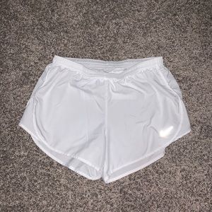 White Nike running shorts